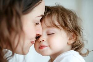 Sweet moment of a mother and child sharing an affectionate embrace indoors during a quiet morning photo