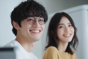 Smiling young couple enjoys a joyful moment together in a bright, cozy indoor space during the day photo