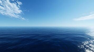 Blue ocean with soft ripples flowing beneath a pristine, cloudless sky photo