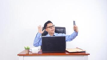 Asian Businessman Employee Talking on The Call with Phone on White Background photo