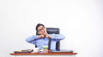 Frustrated and Overworked Asian Office Worker on White Background photo