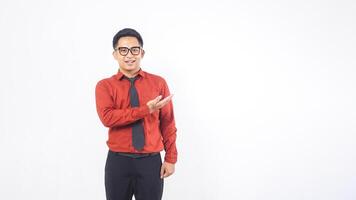 Portrait of Handsome Young Adult Asian Man Presenting Something with Copy Space on White Background photo