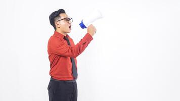 Side View of Excited Asian Male Office Worker Business Man in Formal Outfit Shouting on Megaphone on White Background photo