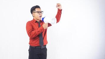 Excited Asian Male Office Worker Business Man in Formal Outfit Shouting on Megaphone Doing Demonstration on White Background photo