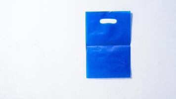 Blank Blue Plastic Bag Mock Up on White Background photo