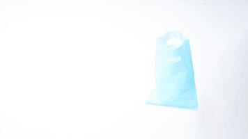 Empty Open Light Blue Plastic Bag with Handle on White Background photo