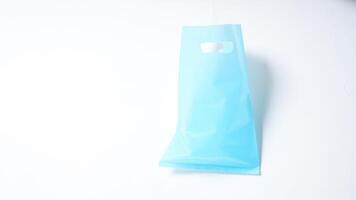 Open Blank Light Blue Plastic Bag Mock Up on White Background photo