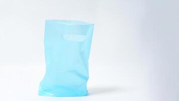 Empty Open Light Blue Plastic Bag Mock Up on White Background photo