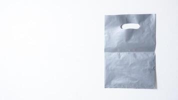 Blank Gray Plastic Bag Mock Up on White Background photo
