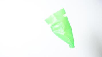 Side View of Open Green Plastic Bag with Handle on White Background photo