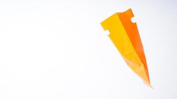 Open Orange Plastic Bag with Handle on White Background photo
