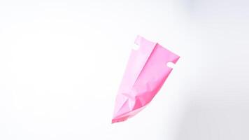 Side View of Open Pink Plastic Bag with Handle on White Background photo