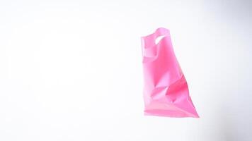Open Pink Plastic Bag with Handle on White Background photo