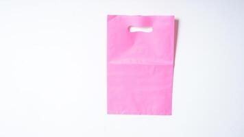 Blank Pink Plastic Bag Mock Up on White Background photo