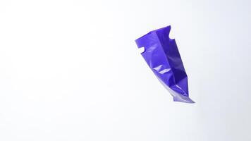 Side View of Open Purple Plastic Bag with Handle on White Background photo