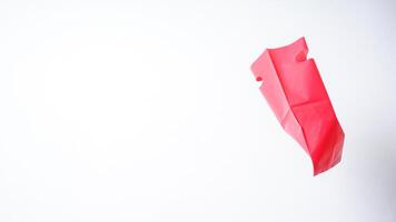 Flying Red Pink Plastic Bag Mock Up with Copy Space on White Background photo