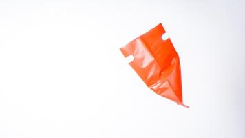Side View of Open Red Plastic Bag with Handle on White Background photo