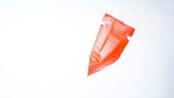 Side View of Open Red Plastic Bag on White Background photo
