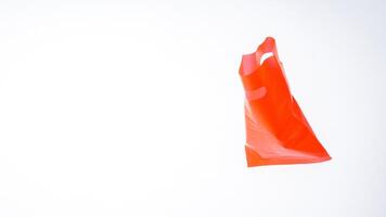Open Red Plastic Bag on White Background photo