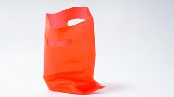 Empty Open Red Plastic Bag on White Background photo