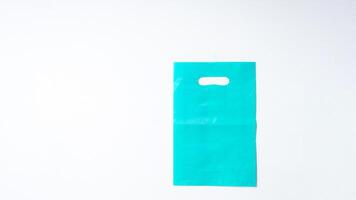 Blank Turquoise Plastic Bag Mock Up on White Background photo