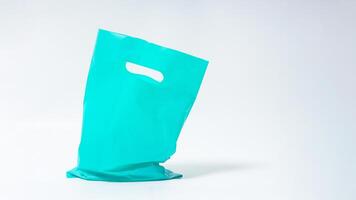 Open Turquoise Plastic Bag Mock Up with Copy Space on White Background photo
