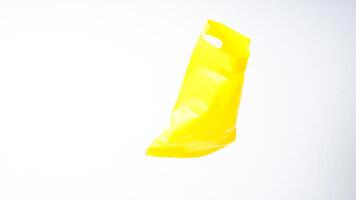 Open Yellow Plastic Bag Mock Up with Copy Space on White Background photo