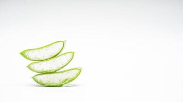 Heap of Aloe Vera Slices on White Background photo