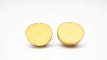 Two Halves Cut of A Fresh Potato on White Background photo