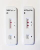 Two sars cov 2 antigen rapid diagnostic test showing positive result photo