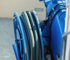 Drain cleaning machines, also known as drain snakes or augers, are specialized tools used to clear blockages in pipes and drains. photo
