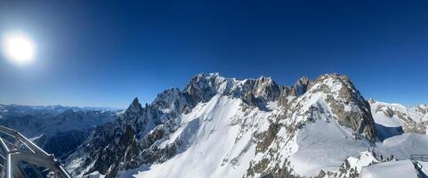 Mont Blanc massif illuminating under the winter sun in the italian Alps photo