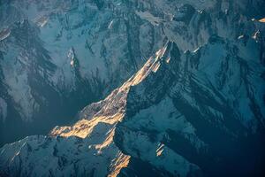 Snow capped Himalayan mountain peaks in China photo