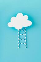 Step ladder made of paper drinking straws leading to cloud made of white paper card note on light pastel blue background. Minimal growth, future, development concept. Flat lay, top view banner. photo