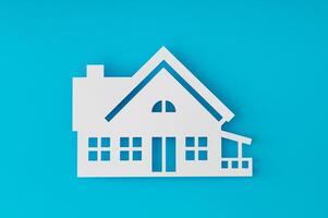 House shaped paper cutout on light blue background. Minimal concept. Flat lay style. Top view banner. photo