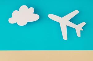 Travel concept made with cloud and plane paper cards on light blue and beige background. Trendy vacation idea. Unique holiday flat lay. Creative copy space. Top view banner. photo