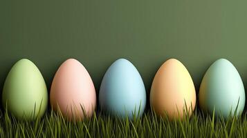 Easter eggs in pastel colors in grass on green background, with copy space photo