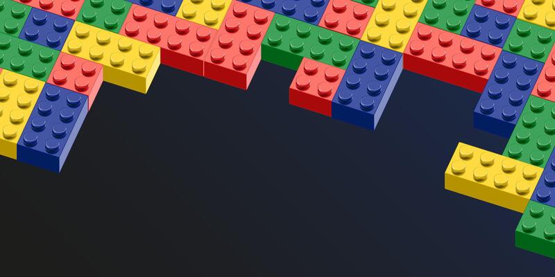 toy brick blocks wall with a black background