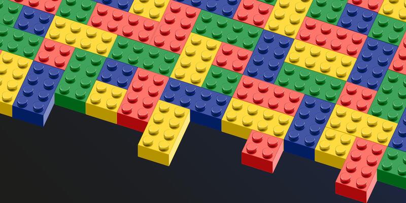 a colorful brick wall with many different colored bricks