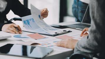 Business people working on papers at a table video