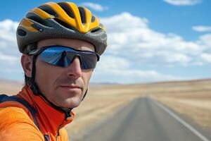 A man wearing a helmet and sunglasses on a road photo