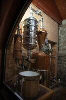 A view of a room with a large barrel and a pot photo