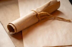 a rolled up piece of paper with a piece of string photo