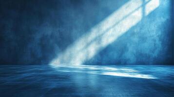 An abstract image featuring a blue textured wall illuminated by sunlight, creating a serene and contemplative atmosphere in the room. photo
