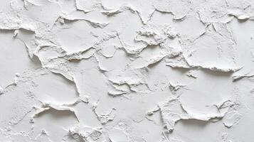 White textured surface with intricate patterns, casting subtle shadows creating a visually engaging and tactile experience. photo