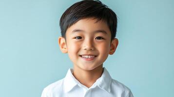 Portrait of a smiling young boy, radiating joy and innocence with his bright eyes and cheerful expression against a serene backdrop. photo