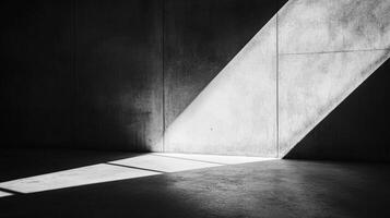 Dramatic light in a stark concrete room, creating strong contrast and a sense of minimalist emptiness, light is a key design element photo