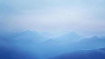 Serene blue mountain range fading into a misty horizon, creating a sense of tranquility and natural beauty. Ethereal view. photo