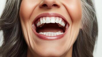 Radiant smile showcasing healthy teeth and vibrant joy, highlighted by soft lighting and focus on expressive mouth features photo