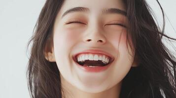 Radiant joy captured in a beaming smile, highlighting natural beauty and expressing pure happiness with closed eyes and flowing hair. photo